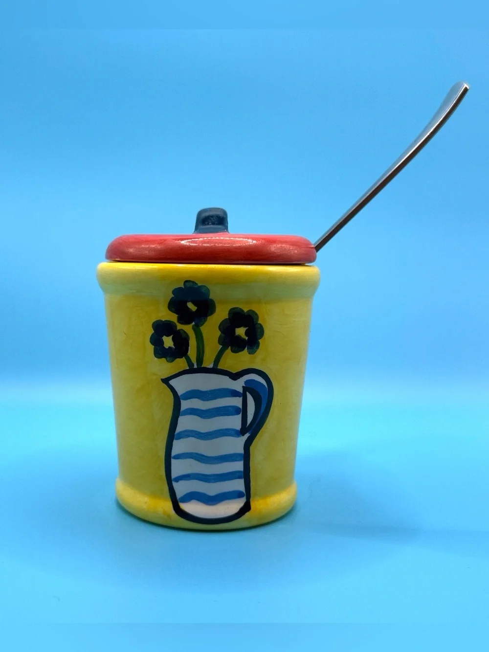 Bright Yellow Ceramic Jam Pot with Red Lid and Blue Floral Pitcher Design